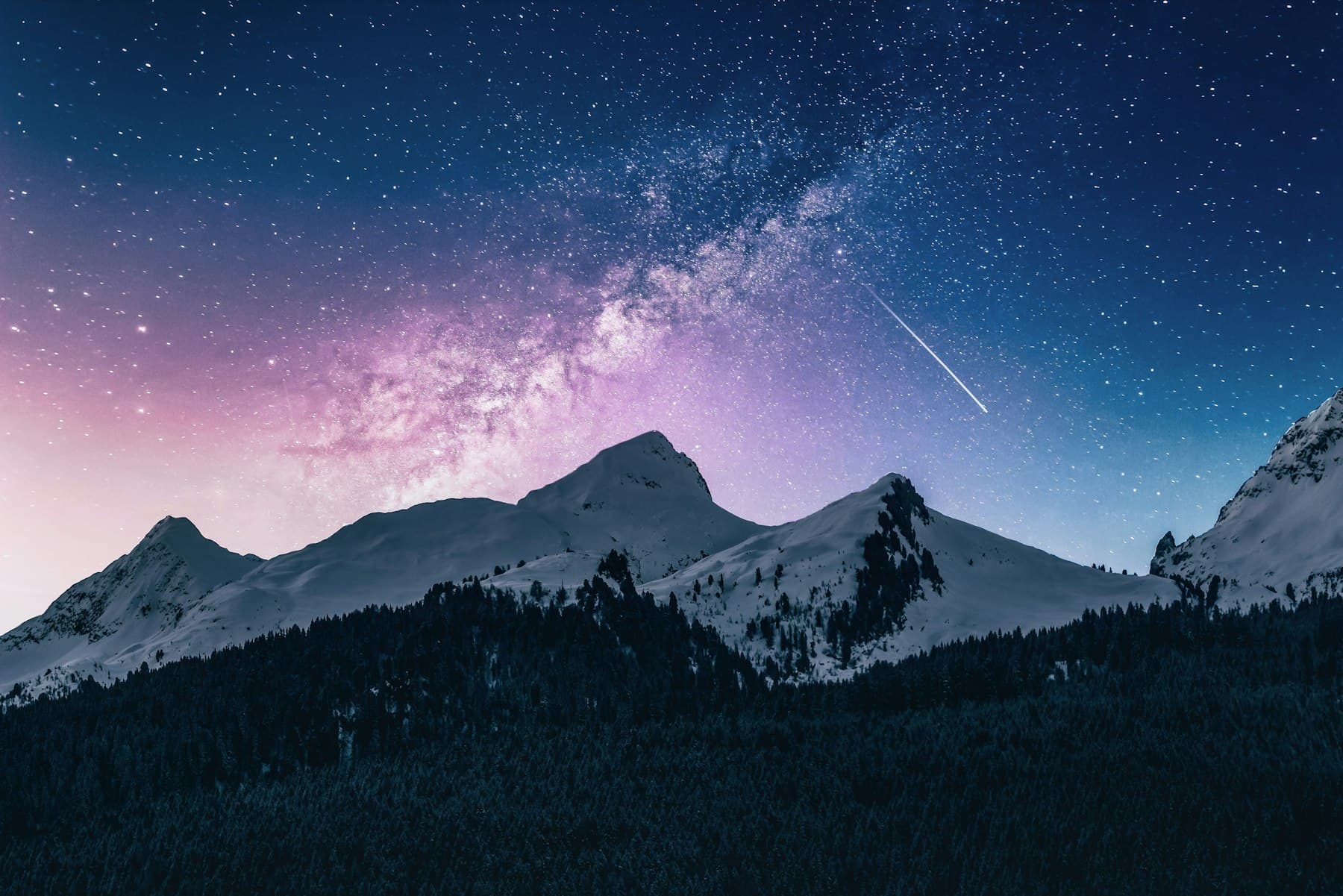 Mountains under a starlit sky